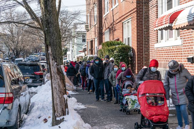 New York Cares volunteers in partnership with Together We Can local non-profit organization and Assemblywoman Catalina Cruz distribute holidays toys and winter coats in Corona, Queens. The line of people, shown here, stretched to seven blocks.
